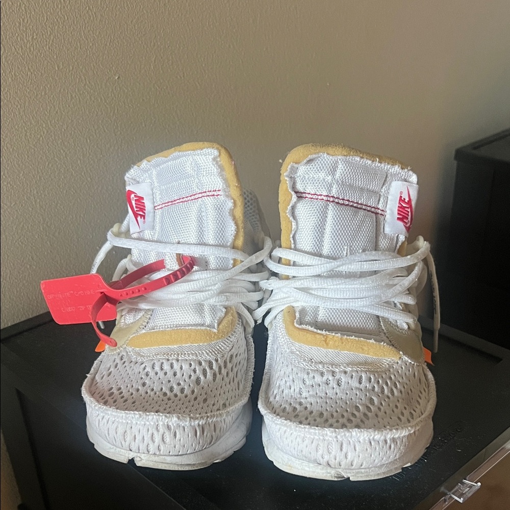 Nike Kids White Sneakers with Tan Accents and Pink Tag